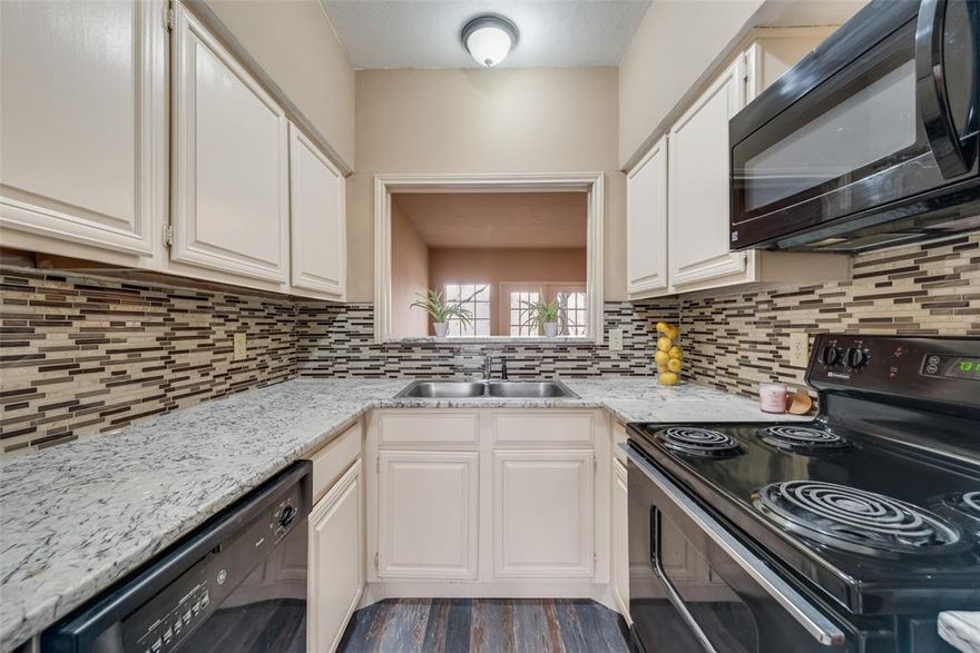 VACANT and MOVE-IN READY, this great INVESTMENT PROPERTY has been recently UPDATED and offers excellent rental Low-maintenance living. Freshly painted walls create a light and bright interior, and modern finishes make this a true turnkey opportunity. Recent updates include carpet replacement, granite countertops, backsplash, and a bar in the kitchen, plus updated fixtures and lighting. This desireable 2 bedroom, 2.5 bath is located in Woodlands within Richardson ISD. The primary suite features two spacious walk-in closets and abundant storage. The secondary bedroom offers its own private entrance making it ideal for roommates or added flexibility. Enjoy beautiful creek views and mature trees right outside your door on the patio. Reserved covered parking is just steps from the unit. The community offers an inground pool, hot tub,and club house- perfect for relaxing or entertaining.  Conveniently located near DART, shopping, dining, and major highways. Blanket insurance is covered by the HOA.