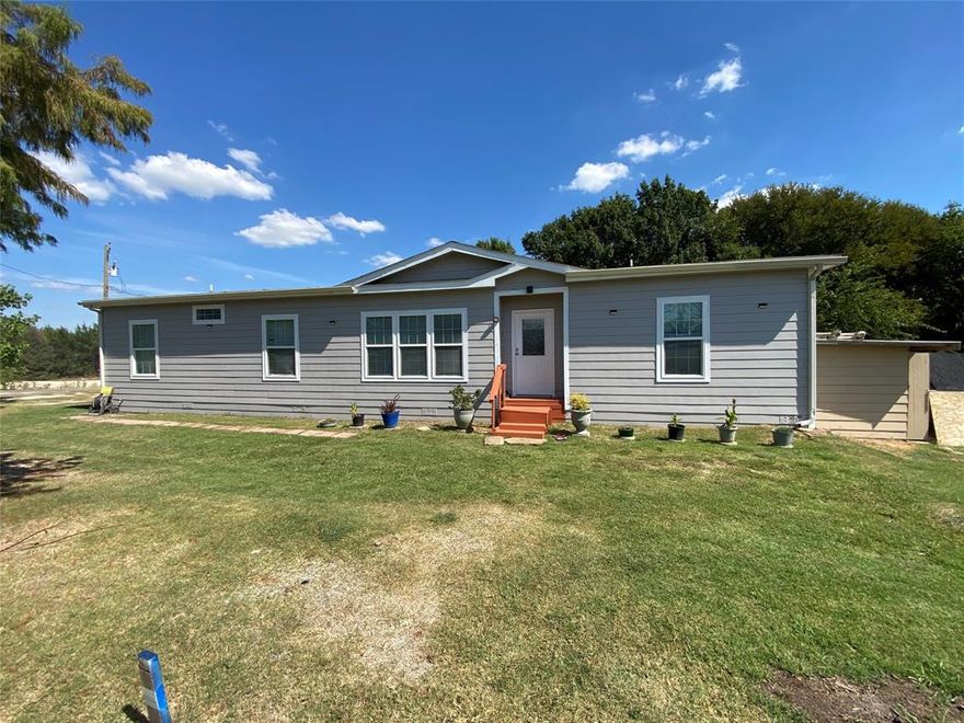 Motivated Seller. This double wide manufactured residence features 1800 square feet of open concept living space. All freshly painted the home includes 3 bedrooms, 2 bathrooms and an additional office or flex room connected to the primary suit. The kitchen features granite countertops, a functional island, ample dining accommodations, and refined lighting. The dedicated laundry room provides an additional sink and generous workspace for storage and folding. The Master suite features a garden tub and an expansive walk-in closet. No HOA. The home was installed in 2016 and is situated on .17 of an acres totaling 7,405 square feet. Not too big to maintain. Seller is motivated.