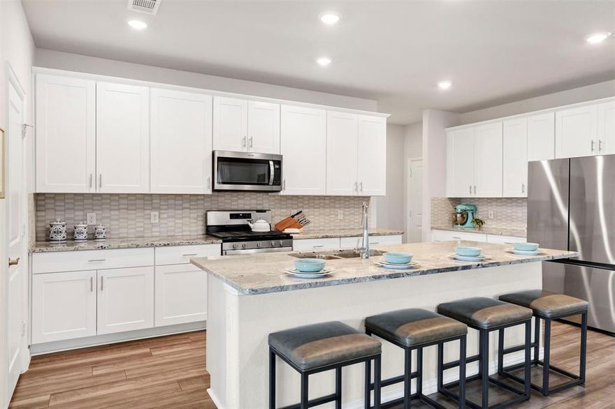 Just 2 years old, this home offers the feel of new construction with the benefit of being in an established part of the neighborhood with no construction noise or dust; just tree-lined streets and neighbors already settled in. The sellers have gone above and beyond by adding thoughtful landscaping and drainage, giving the backyard a polished look and plenty of space to play, relax, and entertain. With no back neighbors, the covered patio and sliding doors to the open living area create the perfect setting for both quiet evenings and lively get-togethers.

Inside, the home is designed for today’s lifestyle, with a private office at the front, a versatile bonus room and 3 bedrooms upstairs, and a tucked-away primary suite downstairs for added privacy.
Even better, the sellers are offering a credit to help buyers lower their interest rate; making this a strong alternative to nearby new builds, but with upgrades already in place. This home is the perfect blend of comfort, function, and community all in one, and all for a great price!