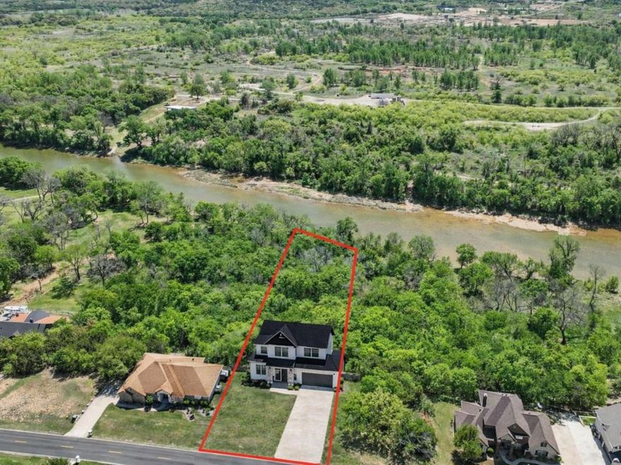 True Brazos River frontage inside the gated and guarded community of Pecan Plantation offering approximately 0.75 acres with over 100 feet of river frontage, heavily treed and naturally private. This is one of the last remaining opportunities to secure true riverfront land where you can purchase now, build when you are ready, and begin enjoying the lifestyle immediately. Ownership allows full access to Pecan Plantation amenities including golf, marina access, clubhouse, parks, and trails, proving that building later does not mean waiting to live well. The lot’s natural elevation, mature trees, and direct access to the Brazos River create the ideal setting to design a custom home that maximizes water views and outdoor living. Bring your own builder and build on your timeline. Owner financing may be available with acceptable terms. Pecan Plantation is a self-contained community offering a grocery store, bank, veterinary clinic, salons, Ace Hardware, restaurants, gas station, marina, equestrian center, archery range, RV park, tennis courts, pickleball, two championship golf courses, and a volunteer fire department, all within the gates. Visit ppoaweb.com for a full list of amenities and discover why so many choose to call this riverfront community home.