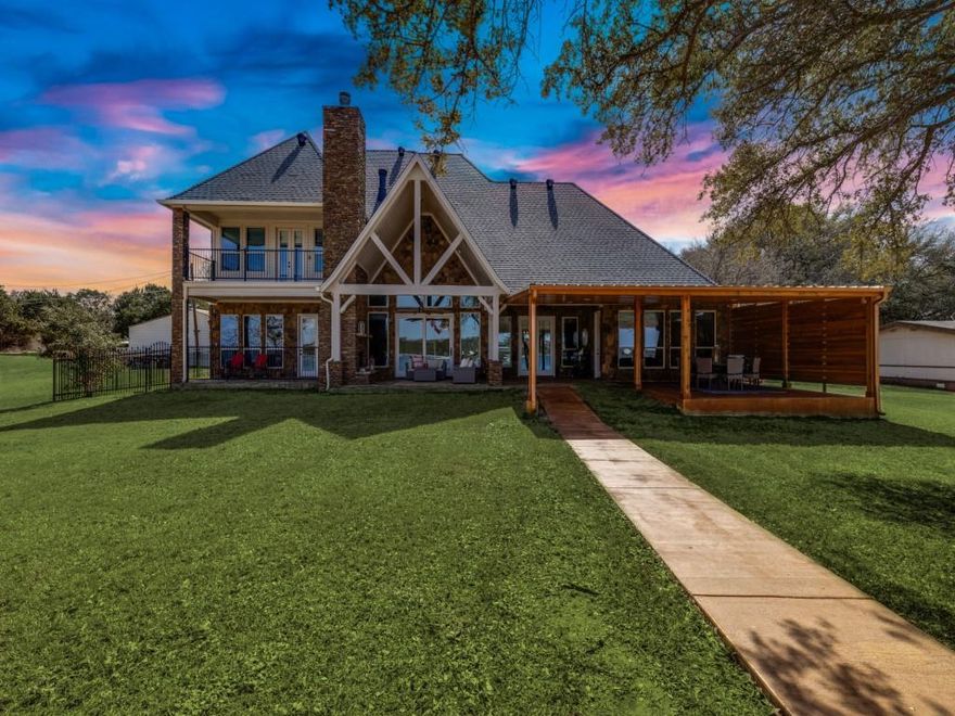 Multi-generational,  non-furnished lake home with no steps leading to the excluded covered boat dock and sandy shoreline! Lake view & access from the great room, kitchen, 2 main floor primary suites & half bath. This home is super easy to enjoy lake time. Covered patio & outdoor fireplace. 3 Beds & 3 baths up plus Media room with wet bar & balcony, half bath  & huge bunk room or game room. Main floor also holds a 2 story entry, office, drop zone, laundry & numerous closets. A 3 Car garage, dog run & storage shed complete this fantastic 1+ acre property sitting on the coveted North side of the Peninsula at Possum Kingdom Lake. This property would also make a great full-time residence or VRBO vacation rental.