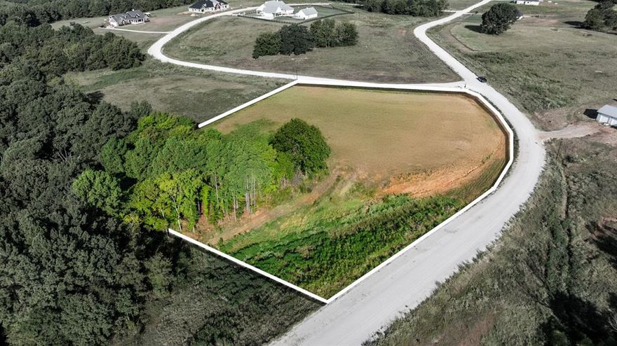 2.24-Acre Corner Lot in Veritatis Splendor – Winona, TX 
Discover the perfect canvas for your dream home on this expansive 2.25-acre lot located in the serene community of Veritatis Splendor in Winona, Texas.

This beautiful corner lot offers a blend of wide open space and privacy, with mature trees lining the back of the property. The rear property line backs up to a green space with a spring-fed ravine, providing a scenic natural buffer and tranquil views—ideal for creating a peaceful backyard retreat. With plenty of room to build and grow, this parcel provides endless possibilities for a custom home, garden, or outdoor entertaining area.
Nestled in a quiet, well-maintained POA community, this lot combines rural charm with a sense of community. Enjoy the best of both worlds: privacy and space, with the support of a neighborhood that values harmony and quality living.
* 2.24 acres
* Corner lot
* Trees at the rear of property
* Backs up to green space with spring ravine
* Available utilities at the road- Electric, Water and Internet 
* Located in Veritatis Splendor POA
* Ideal for building your dream home

Don’t miss this opportunity to create your own slice of Texas paradise. Contact us today for more information or to schedule a visit!