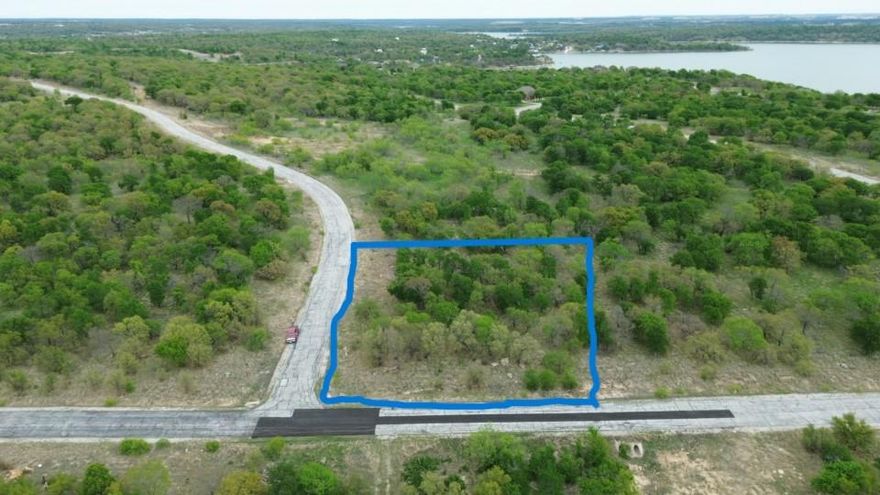 Located within the prestigious North Star Pointe community, this remarkable acre lot offers an ideal opportunity to create your dream home or peaceful getaway. With elevated views of the expansive 12,000-acre Lake Bridgeport, mature trees, and a serene creek bordering the southern edge, this property provides a tranquil and picturesque setting. The neighborhood is secure and gated, with paved streets, city water, and underground utilities for convenience.

Residents enjoy access to exclusive amenities, including a private pool, boat ramp, boat dock with day slips, and sports courts for tennis, pickleball, and basketball. The abundant wildlife, such as deer, adds to the charm and natural beauty of the area, making it a paradise for nature enthusiasts. Whether you're seeking outdoor adventure, a peaceful retreat, or the perfect location for your forever home, this lot offers the ideal backdrop for your vision.