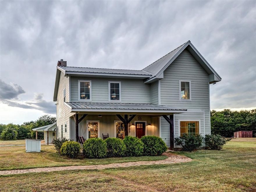Stunning Modern Farmhouse on 13 Acres with Full Guest Quarters in Bowie!  This exceptional 2,345sf home is nestled among mature tree lines offering privacy and a peaceful country setting.  Built in 2014, this 3 bedroom 2 and a half bath home features stunning craftsmanship, including beautiful quartz countertops, center island, farm sink, antique vanities, stained concrete flooring and an additional bonus room that can easily adapt to your needs.  The heart of the home is its open-concept living area, ideal for entertaining or relaxing, and the freestanding wood burning stove provides warmth and atmosphere to your evenings.   Step outside to a custom brick patio area, complete with a cozy fire pit and ample space for gatherings. Another standout feature of this property is the newly built 630sf guest house which offers 1 bedroom, full bath, kitchen, living room, laundry area and covered porches.  The entire property is fully fenced, ag exempt, has a seasonal pond and beautiful native grasses.   Other amenities include 3x5 safe room under the stairway in main house, 3 carport spaces for parking and a storage shed.  No HOA, paved road and outside of city limits!  This is a must see!