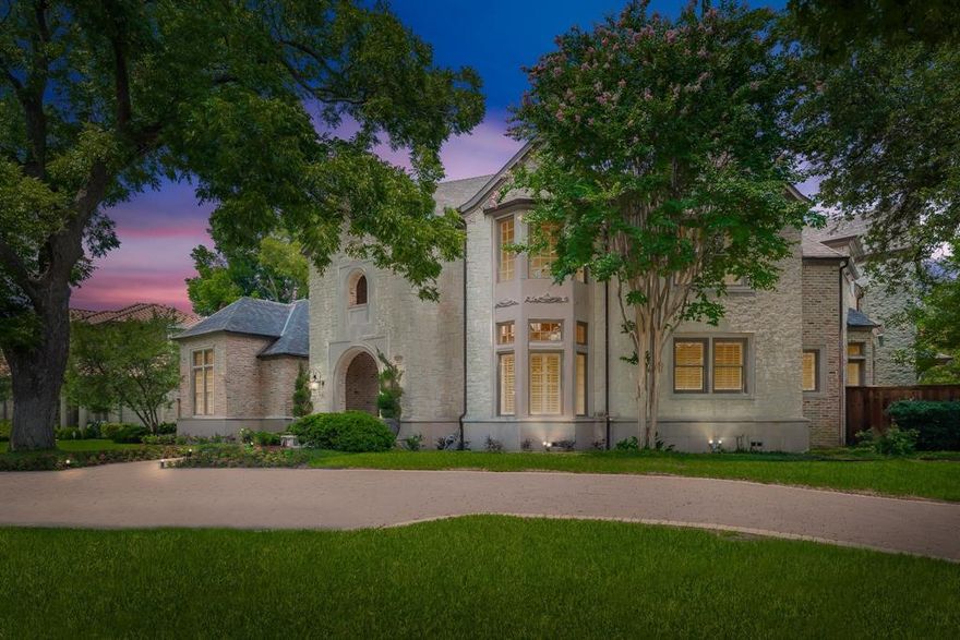 Spectacular Refresh! This Preston Hollow estate home on oversized corner lot, built by Mark Molthan with exacting attention to detail has been updated by a noted interior designer to reflect today's lighter, brighter style. Stunning drive up appeal and custom home features, including soaring 20 foot ceilings and gorgeous moldings and a stunning, unique S-curve staircase. Chef’s kitchen with stainless appliances. Wine room, formal dining and open family room with stone fireplace. Primary suite has second fireplace, luxury bath with exercise alcove. One guest suite downstairs – two guest suites upstairs along with media room and game room. Outdoor living area with pool, large deck, putting green and fire pit.