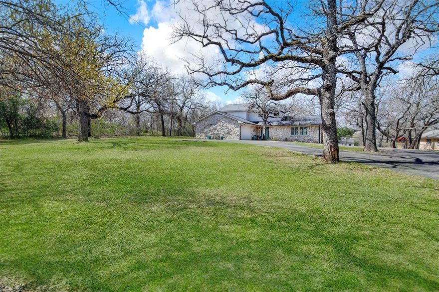 Country Living located minutes to city amenities and major highways.  This Classic Style two-story home Welcomes you the minute you drive up on the quiet, serene, heavily treed, but neatly landscaped, nearly 1 acre lot. Lot features: Paved Circle Driveway, Large Fenced backyard with Gate Access on both sides; Firepit area, Outdoor Living area and Storage Shed.  Next, Step into the Beautiful Large Open Living Room with Vaulted Ceilings and Gas Fireplace that flows to the recently Remodeled Kitchen, featuring: Large Eat-in Kitchen Island with Pull Out Counter for additional seating, Leathered Granite Countertops, Stainless Steel Appliances, Hall Pantry, Large Sliding Glass Pass-through Window overlooking the peaceful and relaxing outdoor space; Boasting an oversized outdoor Living and Dining area with Vaulted Ceilings, Flat screen TV, Gas Fireplace & Separate Firepit area for all your entertaining needs. The Primary Bedroom with Full Ensuite Bath is located on the main level; with Separate Laundry Room and half bath-powder room.  The 2 car garage has beautiful Epoxy coated floors, Rubbermaid Utility hook strips and room for storage. Upstairs you will find 2 spacious bedrooms with brand new fresh Carpeting, a Full Bath and a Workspace Nook. Don't miss this great opportunity to own this hidden gem in a great location!