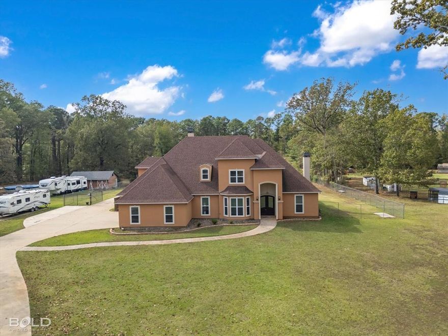 Come take advantage of this bank owned estate just a stone's throw from Cross Lake. Sitting on 2.32 acres, the massive 5046 sq ft home built in 2015 features 5 bedrooms..that's right FIVE bedrooms, & 3.5 baths. Walk into an open floor plan with beautiful wood tile flooring throughout the living areas. A large formal dining room greets you as you walk in, followed by a beautiful staircase leading upstairs that is open to the living rm with floor to ceiling windows overlooking your large covered patio. And wait until you see the kitchen; cabinets for days & stunning granite countertops! Stainless steel appliances along with a large breakfast bar. Beautifully designed master bedoorm featuring coffered ceilings & marble flooring. A show stopper of a master bath that has his & her vanities, a massive soaker tub, & full walk-in shower with multiple shower heads. All guest bedrooms are upstairs. Fully carpeted. Each one has access to a private bathroom along with tons of space & ample closet space. Each bathroom has tiled showers and granite countertops. 5th bedroom could double as a bonus room. And let's not forget about the office that is down stairs as well. Huge utility room that has additional sink for cleaning along with a small desk area. And you can't get away from all the space that comes outdoors. Out back is a massive, covered patio that has hook ups for gas & water should someone want to install an outdoor kitchen. Multiple fenced areas allowing for space to have animals, a garden, or anything your heart desires. Get the perfect blend of modern mixed with country living while still in the city. 3 car side entry garage plus a super long driveway allows for plenty of parking for all your vehicles, toys or boats. Don't miss out on this gorgeous piece of property. Book your private showing today.