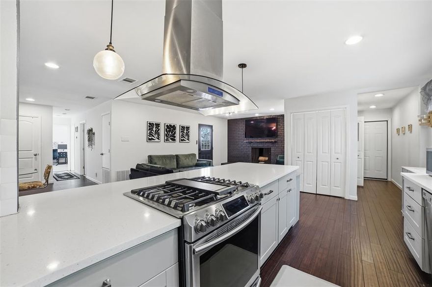 Discover comfort, character, and convenience at 8142 Clear Springs Road in Dallas, a beautifully maintained single-story home nestled in the desirable Central Park neighborhood within Richardson ISD. Offering 1,624 square feet of thoughtfully designed living space, this 3-bedroom, 2-bath residence blends timeless traditional architecture with tasteful updates throughout. Warm wood flooring, decorative lighting, and an open floorplan create an inviting atmosphere ideal for both everyday living and entertaining. The spacious galley kitchen features quartz counters, dual sinks, built-in cabinetry, stainless-steel smart appliances including a gas range and vent hood, and a walk-in pantry. All appliances remain with the home, including indoor and outdoor refrigerators, microwave, washer and dryer with pedestal drawers — all less than four years old. A cozy brick wood-burning fireplace anchors the main living area, and a tasteful blue accent wall with shelving adds personality to the living room. The private primary suite offers an ensuite bath and walk-in shower. Situated on a beautifully landscaped interior lot of nearly a quarter acre, the property boasts a large backyard, covered patio, side-facing garage, and a black roof installed just four years ago. With its incredibly centralized DFW location and access to sought-after RISD schools, this home delivers exceptional value, comfort, and long-term livability in one of North Dallas’ most convenient corridors.