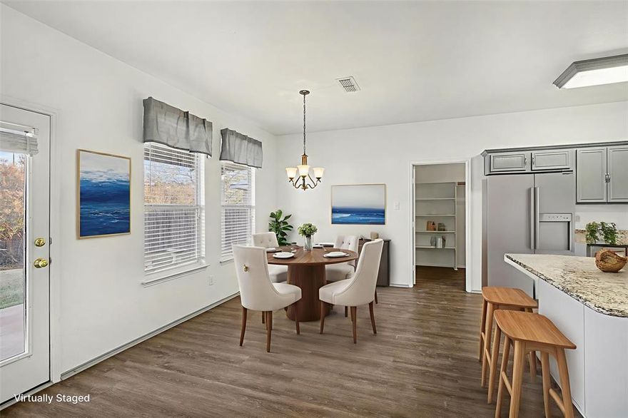 This beautifully updated 3-bedroom, 2.5-bath home is located in a very desirable neighborhood and offers the perfect blend of comfort, style, and space, with abundant natural light throughout and true peace of mind. Featuring two spacious living areas and an open-concept floor plan, this home is ideal for both everyday living and entertaining. The large upgraded kitchen showcases freshly painted cabinets and flows effortlessly into the main living spaces. Recent updates include new wood flooring, new carpet upstairs, fresh interior paint, and a newly renovated shower in the primary bathroom. The primary suite serves as a private retreat with a spa-like ensuite featuring a soaking tub, separate shower, dual sinks, and an extra-large walk-in closet. Step outside to enjoy the extended covered back patio overlooking the fenced backyard—perfect for entertaining, relaxing, or outdoor dining. With plenty of room to spread out, thoughtful upgrades throughout, and a location that offers both convenience and comfort, this move-in-ready home delivers lasting value and peace of mind.