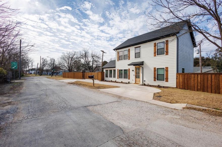 Come take a look at this modern two-story new build with tons of charm! This home perfectly situated on a desirable corner lot, conveniently located just a few minutes from TCU, Barnes & Noble Books, Neighborhood Walmart, Kroger Foods, I35 & I30. This thoughtfully designed home seamlessly blends timeless character with modern updates, offering the perfect retreat for today's lifestyle. Step inside to discover an inviting open-concept floor plan bathed in natural light. The living area features a cozy fireplace, open shelving, and built-in cabinets for ample storage. The kitchen boasts luxurious quartz countertops, a sleek tile backsplash, light wood floors. The spacious layout is perfect for entertaining, with every detail crafted for comfort and style. Upstairs, enjoy the convenience of a coffee bar, ideal for quiet mornings or hosting guests. The lofty office space provides a tranquil environment for remote work or study. Outside, the home continues to impress with automatic gated private parking, an additional front paved driveway, and a charming craftsman exterior that adds unbeatable curb appeal. Whether you're relaxing in the beautifully designed spaces or enjoying the convenience of the prime location, this home truly has it all. Don't miss your opportunity to own this masterpiece—schedule your private showing today!