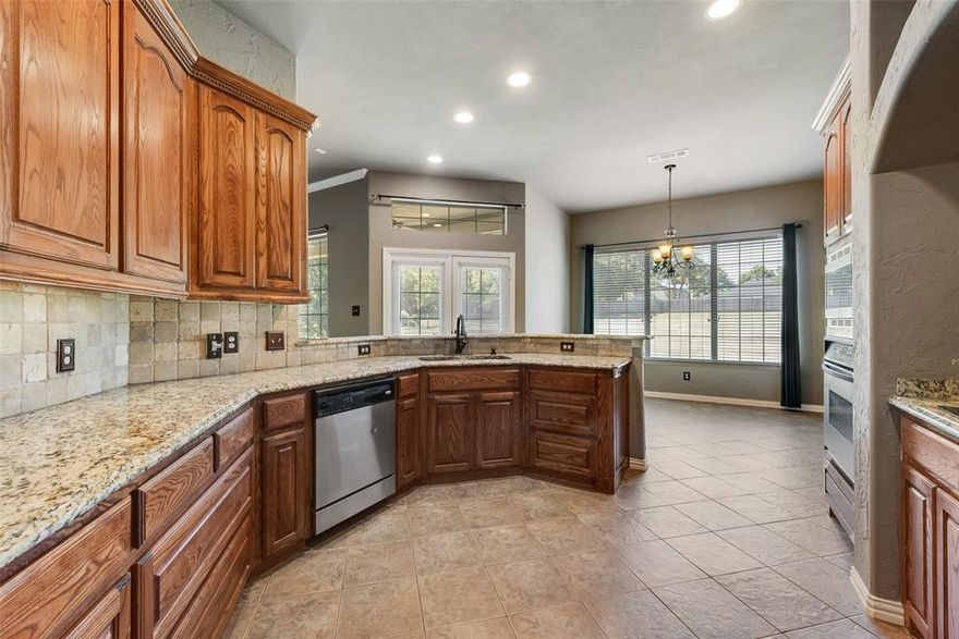 Strategic price improvement made making this an exceptional buying opportunity! The sellers are ready to turn the page to the next chapter. Welcome to this exceptional custom-built home, nestled on a 1-acre lot in the exclusive, gated community of Rose Creek Estates—offering privacy, luxury, and NO city taxes. Located outside city limits, this home provides the perfect blend of tranquility and convenience. Upon entry, you’re greeted by soaring ceilings, a grand staircase, and elegant hardwood floors that flow through the formal study and dining room—both flooded with natural light from large windows. The spacious living area features a dramatic floor-to-ceiling stacked stone wood-burning fireplace and a wall of windows framing serene backyard views. The gourmet kitchen is a chef’s dream, showcasing stainless steel appliances, granite countertops, abundant cabinetry, a brick-detailed cooktop surround, walk-in pantry, breakfast bar, and cozy breakfast nook with more stunning views. The luxurious primary suite on the main floor boasts vaulted ceilings, bay windows, private patio access, and a spa-inspired en-suite with jetted tub, oversized walk-in shower, dual vanities, and a massive walk-in closet. An additional guest bedroom is located on the main level, while all secondary bedrooms are upstairs—each with ensuite bathrooms. The upper floor also includes a media room and large game room, perfect for entertaining. Step outside to your own private oasis: a huge covered patio with ceiling fans, a beautifully landscaped yard, and wrought iron fencing—ideal for relaxing or hosting gatherings. New Roof 2023, New HVAC 2024