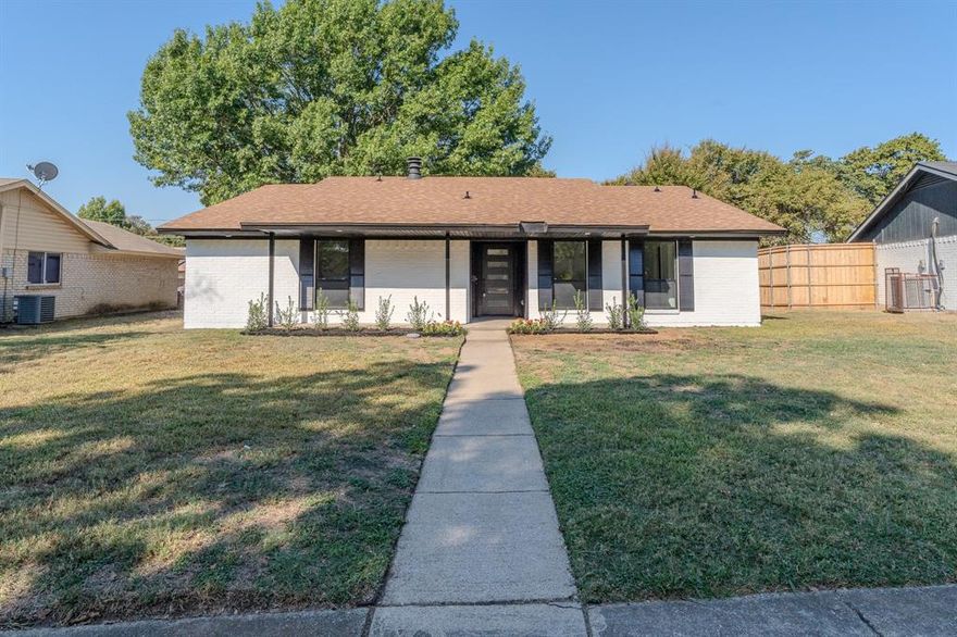 This beautifully remodeled 3-bedroom, 2-bathroom home offers modern style and comfort throughout. Step inside to find brand new luxury vinyl plank flooring, new quartz countertops, and a fully updated kitchen featuring elegant black fixtures. The bathrooms have been completely transformed with modern LED mirrors and sleek finishes, while the living room centers around a charming brick fireplace and a custom-built entertainment center that elevates the space with both warmth and functionality.

Each bedroom includes a spacious closet, and the home’s new energy-efficient windows throughout fill the space with natural light while helping reduce utility costs. Outside, enjoy a large backyard surrounded by mature trees for added privacy, along with a two-car garage and an expansive paved driveway offering ample parking. Conveniently located just minutes from dining, shopping, and everyday essentials, this home perfectly balances modern upgrades with everyday livability.