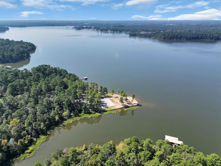 Lakefront lot on prestigious Lake Tyler West on Eastside Road offering 337.22 linear feet of shoreline in Smith County, Texas. This rare, 2.712-acre, oversized waterfront property boasts spectacular southwest-facing sunset views and open water vistas. Located just 3 minutes north of the historic Lake Tyler Yacht Club, this prime building site offers the ultimate Texas lake living experience.

Sunset lovers will appreciate the southwest-facing lot with mature loblolly pine, dogwood, oak and bald cypress trees creating natural privacy and shade while maintaining breathtaking water views. The thoughtfully planned lot offers parklike topography ideal for your dream waterfront home or weekend retreat. Professional Brattlof boathouse renderings included showcase stunning development potential.

Shared access gravel drive with adjacent lots. Southern Utilities water and Oncor electric available at road frontage. No building restrictions on this City of Tyler leasehold property. Fish species include largemouth bass, crappie, channel and blue catfish, bluegill.

Lake Tyler West, a 2,400-acre recreational paradise, offers world-class largemouth bass fishing, crappie, catfish and bluegill. Texas Parks Wildlife manages this premier fishery with annual Florida bass stocking programs producing trophy fish over 8 pounds.

Prime location in Tyler, America's Rose Capital, known for its championship bass fishing and outdoor recreation. This East Texas lakefront property is about 1.5 hours to Dallas and Shreveport, 3.5 hours to Houston. Local aviation served by Tyler Pounds Regional Airport (TYR) - 7 miles with American Eagle connections to DFW. Regional airports include Dallas Love Field (DAL) and DFW International - 121 miles.

Make this LIMITED lakefront opportunity your next home or investment. Waterfront lots seldom available on Lake Tyler West - the top recreational lake in the greater Tyler area. Adjacent lots avail.