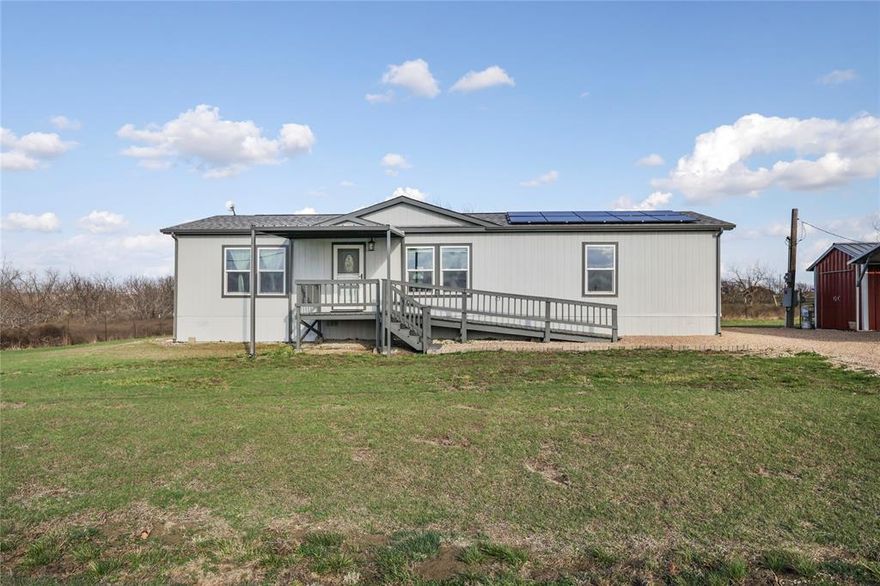 Motivated Sellers! 

Enjoy peaceful country living on 2.61 acres in Venus, TX. Built in 2014, this 3 bedroom, 2 bathroom home offers approximately 1,456 square feet of comfortable living space with a functional layout designed for everyday living. The spacious living area flows into the kitchen and dining area, creating an inviting space for relaxing or entertaining.

The home has seen several recent updates, including a new roof, new windows, new gutters, fresh paint, and a newly built front awning, giving the property a refreshed feel while improving efficiency and curb appeal. There is also an underground storm shelter in the backyard.
Energy efficiency is another major highlight. The property is equipped with a full solar system paired with a Tesla Powerwall home battery backup, helping reduce reliance on the grid while providing dependable power during outages. The solar system operates through a Solar PPA lease that will transfer to the new owner at closing.

Outside, the property offers excellent functionality and storage. A new 3-car covered carport has been installed at the front of the home, while a 2-car covered carport is located behind the home for additional parking, equipment, or recreational vehicles. The property also includes a tool shed and a shipping storage container that will remain, providing great space for tools, equipment, or hobbies. To make maintaining the acreage even easier, the sellers are also leaving a riding lawn mower for the new owners. 

The 2.61 acres of land provides plenty of space for animals, gardening, outdoor recreation, or future improvements.
Conveniently located within driving distance of Mansfield, Midlothian, and the greater DFW area, this property offers the perfect balance of quiet country living with city accessibility. Sellers are highly motivated and ready to make a deal.

Don’t miss this opportunity to own acreage with valuable upgrades, energy-efficient features, and room to make it your own.