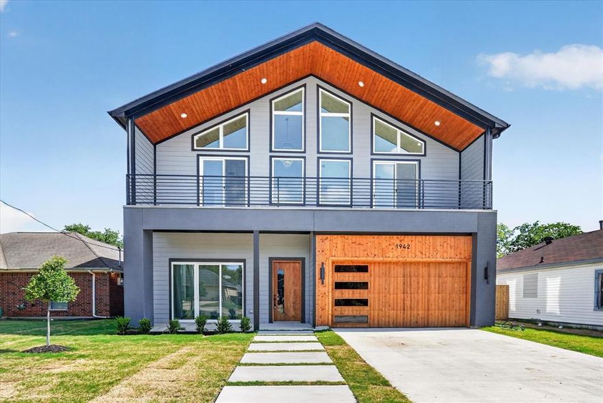 GET IN THIS HOME TODAY. UNBEATABLE up to $25,000 FLEX CASH ON THIS HOME! Experience elevated living in the heart of West Dallas perfectly positioned just over the Trinity Grove Bridge with unbeatable access to Uptown, Downtown Dallas, top dining, entertainment, and major highways.
This stunning modern residence offers 5 spacious bedrooms, 4.5 luxurious bathrooms, and soaring 25-foot ceilings that create a dramatic yet inviting atmosphere filled with natural light. Designed for both upscale entertaining and everyday comfort, the chef’s kitchen features abundant cabinetry, premium finishes, and an open-concept layout that flows seamlessly into the main living space.
A striking floor-to-ceiling Venetian plaster fireplace wall serves as the centerpiece of the home, adding warmth and sophisticated modern design. The expansive primary suite is a true retreat with breathtaking picture windows, a spa-inspired bathroom, dual shower heads, separate vanities, PLUS separate grooming vanity with LED mirror lighting. ALL bedrooms includes its own PRIVATE en suite bath, offering ultimate privacy and convenience for family and guests alike.
Located in one of Dallas’ fastest-growing and most connected areas, this home blends luxury, location, and modern architecture into one exceptional opportunity.Move in Ready! All APPLIANCES STAY with home. SCHEDULE YOUR SHOWING DAY!