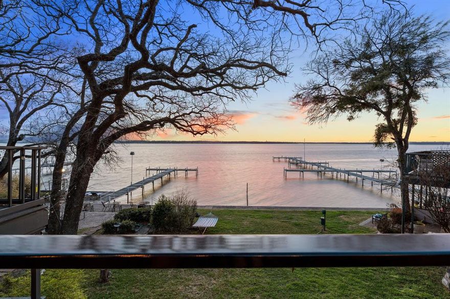 Seller will pay 12 months of HOA dues at closing of acceptable offer. Welcome to your dream home, an immaculate tri-level condo on the serene shores of Eagle Mountain Lake. This recently renovated property offers stunning views and thoughtful design. Enter on the second floor to find a cozy living room with new engineered hardwood floors and elegant wooden beams. The open-plan kitchen is perfect for cooking and entertaining, with a convenient half bath nearby. A loft offers a cozy nook for an office or storage. Step onto the renovated patio with wood-like tile and enjoy breathtaking lake views, perfect for morning coffee. Descend to the lower level to the primary bedroom suite, offering direct lake access and stunning vistas. The remodeled bathroom provides a spa-like experience. The lower level also features a guest bedroom with a remodeled ensuite bathroom, ensuring privacy for visitors. Enjoy two outdoor entertaining areas, ideal for gatherings or peaceful lake moments. Don’t miss your chance to make this exquisite waterfront condo your own! HOA fee includes water, trash, sewer, exterior insurance, exterior maintenance, property taxes for land (homeowner responsible for taxes on their condo unit), cable, internet, streaming services, access to 2 docks and common areas.