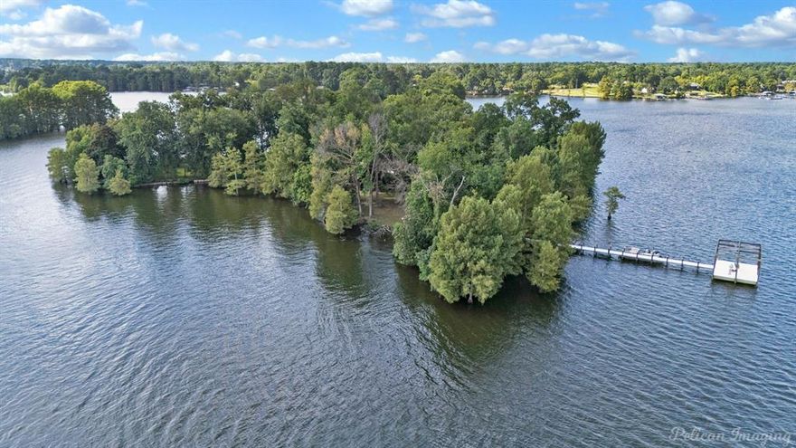 Have you ever wanted to own your own private island?! Here's your chance. The home has been updated. 3 Swepco power lines connect from the mainland. 360° Lake views. Culligan water system filters water from the lake. The owner of this home will have designated parking spot at Barron's Landing Marina. Additional parking at the public boat launch. Cross Lake features the famous Orlandeaux's Cafe you can pull up on your boat for dinner. This is the first time this island and home has ever been offered for sale publicly. The home has never flooded to the sellers knowledge. This is not in city limits.