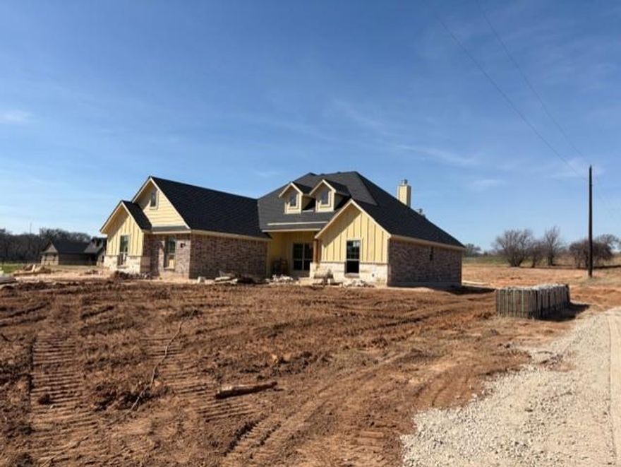 New construction home on 1 acres with lots of nice features. Home has split bedrooms with a large open living area big breakfast bar in the kitchen area with a large pantry. Master includes a walk in shower, double vanities and large closet. Large 3 car garage. Exterior has a large back patio with a wood burning fireplace. Room to roam.