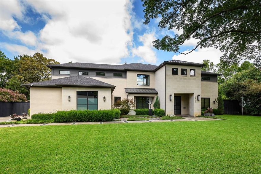 Hidden from the city’s bustle, this exceptional home sits on a serene, tree-lined street in Dallas’ coveted “private school corridor,” backing to a wide greenbelt along Joe’s Creek tributary. Oversized lots and quiet streets create a peaceful setting, perfect for walking, biking, and enjoying the outdoors. A majestic oak tree welcomes you at the entrance.

Designed to embrace its park-like surroundings, the home offers expansive views from every angle. Glass doors in the living room open 180 degrees to a spacious screened porch, creating an extraordinary indoor-outdoor retreat for daily living and entertaining. Thoughtful updates include electric draperies, voice-controlled lighting, and high-end designer fixtures. Outdoor living features a Pavestone terrace, custom fire and water elements, and multiple entertaining areas.

Inside, soaring ceilings and oversized windows fill the home with natural light. The chef’s kitchen boasts dual quartzite waterfall islands, double sinks, Sub-Zero refrigeration, an oversized DCS Fisher & Paykel range with two ovens, Bosch appliances, and sleek cabinetry.

The main level includes a luxurious primary suite with a spa-inspired bath, a private guest suite, and a study. Upstairs, three ensuite bedrooms share a second living area and a large studio overlooking the grounds. The oversized two-car garage is accessed through a mudroom with an adjacent utility room.

Combining tranquility, sophistication, and convenience, this residence is close to the NTTA, Downtown and North Dallas business districts, major medical centers, premier shopping and dining, and easy access to Love Field and DFW airports.