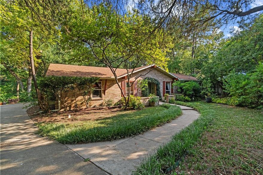 Introducing a lovely creekside home ideal for the creative, the artist, the lover of light and nature. Tucked in among the trees on a charming cul-de-sac is a beautiful home as secluded as it is convenient for a highway commute. Walk in through a lush green canopy to a custom home full of light and color. The living room has a vaulted ceiling, skylight, and a cozy fireplace with a wall of built-ins. The windows in the dining room bring the garden inside, with a view of the atrium-patio where you will enjoy a quiet retreat. A flex room is currently used as an office and den, but could easily become your studio, family room, or private fitness center with relaxing views through the stunning new windows. This is where the laundry facilities are tucked away as well as lots of storage space. The owners have used the other bonus room on this side of the house as an art studio and workshop, with ample work space, storage cabinets, and flat file shelves. A mud room leads to a back deck and patio that overlooks the many trees and the creek. Take a wander and allow yourself to enjoy the natural world all around you. All of this is in addition to three bedrooms and three full bathrooms. The  two-car carport with overhead storage and electricity is on a separate parcel, which is a part of this purchase. The roof is new, the exterior has been freshly painted, the storage shed has been refurbished, and the owners are ready to place this one-of-a-kind home into the hands of someone who will love and care for it as they have. Be sure to view the virtual tour, and schedule a showing today!