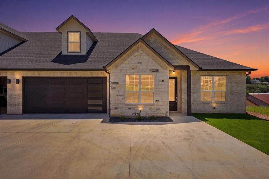 Welcome to the coveted DeCordova Bend Estates! This stunning new construction duplex is your ticket to lakeview living. Offering over 3000 square feet of thoughtfully designed living space in a sought after golf course community this 4 bedroom, 3.5 bathroom home combines functional layout with elevated finishes and multiple areas for entertaining.

The main level features an open concept kitchen designed to stand out with gleaming quartz countertops, abundant cabinetry, and a walk in pantry. The kitchen flows seamlessly into the living and dining areas, creating an ideal space for everyday living and hosting. A walkout balcony extends the living space outdoors and provides serene lake views, perfect for morning coffee or evening relaxation.

The primary suite offers a comfortable retreat with a well appointed bathroom and generous closet space. Additional bedrooms are well sized and thoughtfully positioned to provide flexibility for guests, office space, or additional living needs.

The lower level adds versatility with a large bonus room that can be used as a media room, game room, or secondary living area. A two car garage is located on the main level, along with an additional lower level garage designed for golf cart storage and added convenience.

Residents enjoy access to a variety of community amenities including two golf courses, marina, community pool, pickleball courts, sand volleyball, and more.