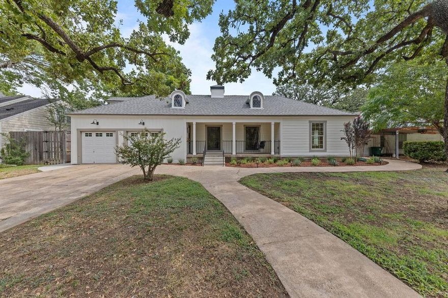 Elegantly remodeled 2 or 3 bedroom, 2 bath home nestled among mature oak and pecan trees in prime location of Oakhurst. All of the most current designer finishes await its new owners. The floorplan makes for easy living with 2 large living rooms--one of which is an open-concept den-dining-kitchen combo, and primary suite with ensuite bathroom. The upstairs space provides great flexibility with owners opting to use it perhaps as a 3rd bedroom, office, media room or extra storage. The interior cosmetics are super chic noting designer colors and materials throughout including all new stainless steel appliances, new cabinets and quartz counters in kitchen, new tile and fixtures with quartz counters in fully remodeled bathrooms, fresh paint inside and out, all new light fixtures and newly refinished original wood floors. Large backyard is great for relaxing or entertaining friends and family. So close to Oakhurst Park, downtown, Stockyards and W. 7th with all of its great restaurants, shopping and nightlife. New roof installed in Aug 2025 with transferrable Lifetime Limited Warranty, Class 3 impact resistant shingles. New electrical panel,  wiring, and plumbing throughout, perimeter landscaping, new blown-in attic insulation, and new water heater all installed 2025. Neighboring house to the right is under contract to be remodeled thereby adding even more value to your investment.