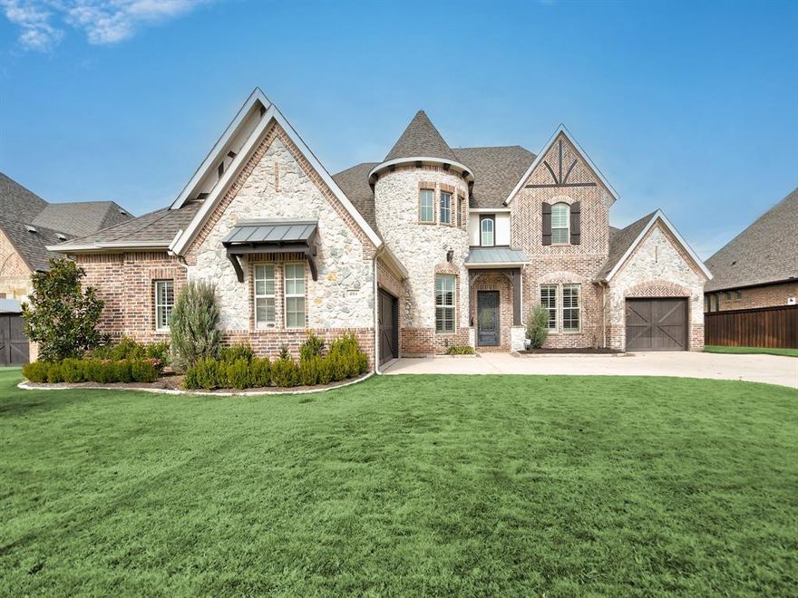 Carillon beauty in the sought after Carroll ISD!  Elegant iron front door welcomes you into this large open home with stunning Restoration Hardware chandelier in entry.  You'll be dazzled by the gorgeous designer wallpaper in the formal dining room.  Desirable open floorplan with hardwood floors throughout the entire first floor. Open island kitchen with SubZero built-in fridge, double ovens, and 6-burner gas cooktop. Large slider door leads to backyard oasis with outdoor living space, fireplace, built-in grill, pool, and spa.  Beautifully redesigned utility room with custom cabinets and tile. Luxury follows through to both garages with epoxy flooring and custom cabinets by Garaginization. The perfect floorplan with primary suite, office, and guest suite downstairs. Up the curved staircase is the media room with granite bar, gameroom with built-ins, balcony, 3 bedrooms, and 3 bathrooms.  Relax in the swing in the corner of the backyard or from the upstairs balcony overlooking the pool.