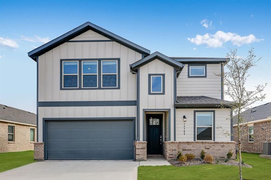 What's special: Game Room - Flat Lot - 5th Bedroom - West Facing Lot. New Construction – Ready Now! Built by Taylor Morrison, America's Most Trusted Homebuilder. Welcome to the Verbena at 14908 Hierba Mora Drive in Madero. This stunning new home greets you with a welcoming foyer that opens into the kitchen, great room, and dining area, perfect for gathering and entertaining. The kitchen features a large island with quartz countertops, premium appliances including a 5-burner cooktop, built-in oven, and microwave, and plenty of space for culinary creativity. RevWood flooring flows throughout the main living spaces, while upgraded ceramic tiles add elegance and durability in key areas. The great room connects seamlessly to a covered patio, creating an ideal space for indoor-outdoor living. The main-level primary suite is tucked at the back of the home and includes a spa-inspired en-suite bath and spacious walk-in closet. A secondary bedroom and full bath are located off the foyer, while upstairs you’ll find a game room overlooking the entry, three additional bedrooms, all with walk-in closets, and a full bath. Madero in Fort Worth, TX offers an open, uncrowded feel with expansive green spaces and thoughtful home placement. Planned amenities include open-air centers, sports courts, a resort-style pool, lush walking trails, and neighborhood retail. Plus, with no MUD or PID taxes, you’ll have even more freedom to explore Fort Worth’s museums, theaters, music venues, and more. Additional Highlights Include: Covered patio, pop-up ceilings at the primary suite and great room, 8' front door, and vent hood. MLS#21120335