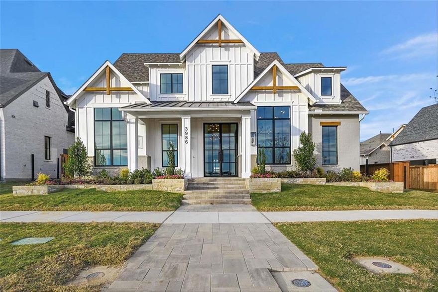 MLS# 20387047 - Built by Huntington Homes - Ready Now! ~ Charming modern farmhouse elevation w painted brick. 22 ft ceilings in foyer, dining & family room w sliders. Dream kitchen has Wolfe & Subzero appliances & furniture quality custom cabinets. Prep kitchen w 2nd dw, sink, ice maker, 2nd fridge and tons of storage. Primary suite w tray ceiling, enormous shower w multiple shower heads, freestanding tub and custom closet. All en-suite bedrooms w 8 ft solid core doors both down & upstairs. Separate 5th bedroom w private entrance, perfect MIL suite. Outdoor living has kitchen w Wolfe grill, mini fridge and fireplace. Oversized utility room with cabinets, sink and mud bench. Upgrades galore include extensive wood floors, Quartzite countertops, wood stairs, lighting, tiles, carpet and much more.