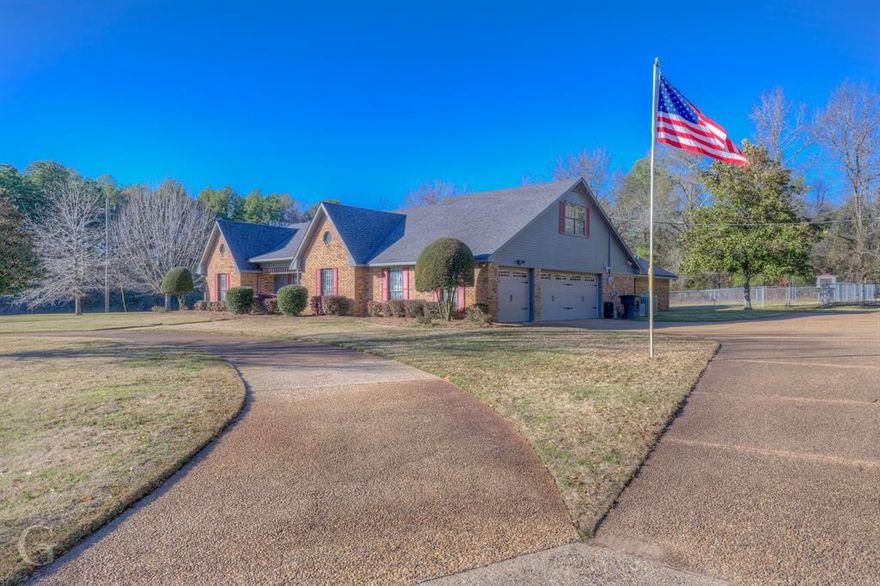 Discover the perfect blend of Ellerbe Springs country living and modern convenience in this well maintained custom built 5BR 2.5 BA 1.5 story brick home nestled on nearly 2ACs just beyond the city limits of Shreveport. The inviting living with vaulted ceilings and gas start FP creates a warm ambiance. The spacious kitchen features granite counters, gas stovetop, electric oven, and charming bay window breakfast nook. A formal dining room adds a touch of sophistication. Retreat to the remote primary suite complete with an ensuite featuring a garden tub, separate shower, dbl vanities, and walk-in closets.  Step outside to the covered patio overlooking the fenced backyard with a flourishing vegetable garden. The property offers a 3-car side entrance attached garage, a circle driveway, and extra covered parking on a 190sf workshop with electric. A 900sf metal workshop with electric and half bath, with covered porch included, ideal for outdoor gatherings and barndominium conversion. Multiple wells and septics on site as well as public utilities. New grocery shopping less than 9 miles.