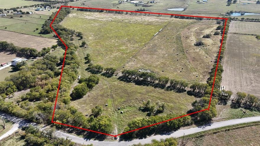 Discover 47.33 acres of peaceful North Texas countryside--a rare, contiguous AG EXEMPT tract that checks every box for privacy, recreation and long-term investment. The property features a tasteful balance of shaded timber and open meadow, with gently rolling contours that drain well and offer multiple ideal building sites with scenic views. Use it as a private legacy estate, cattle or hay operation, hold for future development, or subdivide into multiple parcels. Located within 6.5 miles of I-35 and a quick drive to amenities, major retail, and restaurants.