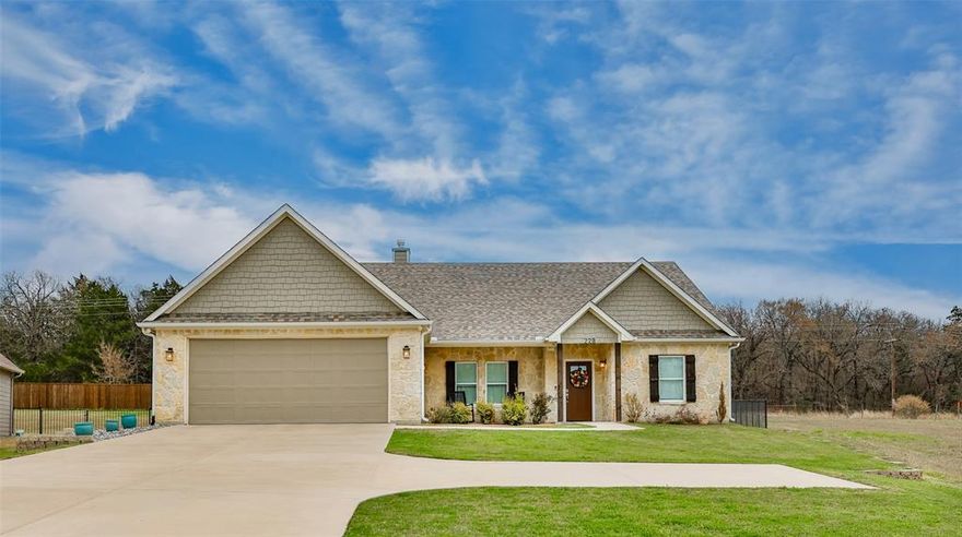 LIVE THE LAKE KIOWA LIFESTYLE!  MOVE-IN READY WITH A FRESH AND CLEAN, NEUTRAL PALETTE.  Just in time for summer, this 4bed, 2.5bath siding and stone home is 100% turn key with a .523ac lot.  Built in 2018, the exterior facade features a variety of accents including a beautiful covered, front and back porch with stone decking.  Once inside, you are treated to a spacious open concept complete with scraped wood floors, floating shelves, a gas fireplace, decorative lighting and an oversized feeling of home.  The kitchen offers white accented cabinet doors, neutral tile work, stainless steel & electric appliances, and a microwave warming drawer.  French door refrigerator will be staying as an added bonus. Tons of cabinet space, long countertops and island storage compliment the design along with a built-in desk and walk in pantry for extra convenience.  In addition to kitchen island dining, there is plenty of room for a full size dining table and side board.  The large, primary suite features a double entry walk-in closet with custom, built-in features and a gorgeous trayed ceiling.  Step into the oversized ensuite bath where you will find a double vanity, with separate tub and walk-in shower.  A large hallway houses both a half bath, a mud locker storage space and a HUGE utility room.  Double door garage with epoxy floors fits two oversized vehicles easily and even offers golf cart storage.  Lake Kiowa residents experience unlimited golfing privileges and full access to lake, fishing, courts, and other amenities.  It is a fully gated community with 24 hr security, guarded entrance at main gate and community entrance on the east side.  Other amenities include: pro shop, club house, dining, bar, pavillion, playground, east and west beaches, courts, community entertainment and organized recreation.