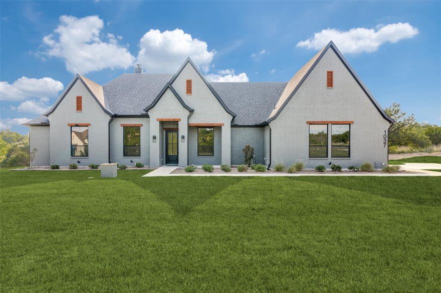 Welcome to Woodland Lakes Caliber Homes Model, THE PATTON. Situated on 2.25 Acres, this home checks all the boxes.Caliber Homes Designs with a Perfect Flow Floorpan Creating Harmony within its Walls.You will instantly recognize the difference when you enter this stunning 3 bedroom, 2.5 bath home that makes 2,710 square feet feel larger. The Separate STUDY, GAME ROOM and PRIMARY BEDROOM all have CUSTOM TRIM WALLS in beautiful moody gray colors. The sleek, modern kitchen elements include a marble style on the popular picket backsplash coupled with bright white quartz countertops.Continuing the trend in the Dining Room, you have the classic tray ceiling but the beams are stained in a modern carbon black.The primary bathroom ensuite holds nothing back when it comes to sheer elegance. Keeping on trend with the marble look, the primary bathroom will feel like a luxury spa getaway every night. The Living Room boasts a 42in stone fireplace and hearth to complete the open concept style.Double oven and large walk in pantry will make you seal the deal on this Modern Transitional Farmhouse.Ask about our incentives and other available homes from this builder.