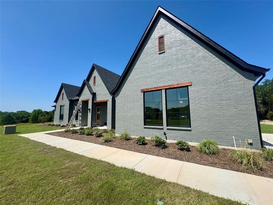 Welcome to Woodland Lakes Caliber Homes Model, THE PATTON. Situated on 2.25 Acres, this home checks all the boxes.Caliber Homes Designs with a Perfect Flow Floorpan Creating Harmony within its Walls.You will instantly recognize the difference when you enter this stunning 3 bedroom, 2.5 bath home that makes 2,710 square feet feel larger. The Separate STUDY, GAME ROOM and PRIMARY BEDROOM all have CUSTOM TRIM WALLS in beautiful moody gray colors. The sleek, modern kitchen elements include a marble style on the popular picket backsplash coupled with bright white quartz countertops.Continuing the trend in the Dining Room, you have the classic tray ceiling but the beams are stained in a modern carbon black.The primary bathroom ensuite holds nothing back when it comes to sheer elegance. Keeping on trend with the marble look, the primary bathroom will feel like a luxury spa getaway every night. The Living Room boasts a 42in stone fireplace and hearth to complete the open concept style.Double oven and large walk in pantry will make you seal the deal on this Modern Transitional Farmhouse.Ask about our incentives and other available homes from this builder. Buyer or buyers agent to verify all information.The Preferred Lender on this property is Randy Atkinson at Synergy One Lending.Agent related to owner.