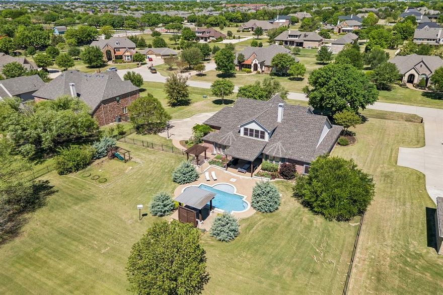 This IS THE ONE!!  Your Dream Home Is Here!!  This Updated, Move-in-Ready home sits on a beautiful one-acre cul de sac lot in Parker, TX, in the Award-Winning Allen School District. This property is where charm, space and privacy come together beautifully. Situated on an 1 acre lot, this property offers the perfect blend of peaceful country living with convenient access to nearby amenities close by. Step inside to discover a thoughtfully designed layout, with custom wallpaper in the dining room, featuring spacious living areas, abundant natural light, and an inviting atmosphere perfect for both everyday living and entertaining. The kitchen serves as the heart of the home, offering ample cabinetry, butler pantry, newly painted cabinets, generous counter space, and a functional layout ideal for any home chef. The primary suite provides a private retreat with a sitting area, with plenty of space to unwind. The Luxury Primary Bath has been completely remodeled with a freestanding soaking tub, oversized shower, Hexagon Marble Flooring and gorgeous pendant lightings. There is a suite with two bedrooms downstairs, with a smaller living space, it can be used as a playroom or another TV room. When you go upstairs, there is a big game room along with another bedroom upstairs and a Full Bath. Great Floor Plan especially when you have guests over. Outdoor OASIS is a Dream, with sparkling pool, multiple covered patios. Too many updates, upgrades and outstanding features to list, but a few include: Main bath, Secondary Bath, and Pool Bath all completely remodeled, New HVAC 2022, New Roof 2025, New Water Heaters 2023 & 2025, Whole Home Ethernet and Security System 2023, Expanded covered porch with power and fan 2025. Newer Refreshed Paint, Custom Wall Paper work, and more!  Located in the highly desirable Parker area, this home offers the rare opportunity to enjoy a serene setting while still being just minutes from shopping, dining, and top-rated schools.