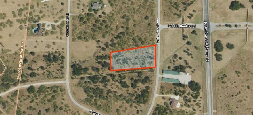 Build your dream getaway on this expansive 1.71-acre lot in the exclusive Hills Above Possum Kingdom. This level, interior lot offers the perfect canvas for a custom residence with easy access to premier amenities, including a gated entrance, clubhouse, and private boat ramp. Experience the tranquility of Graford while being just minutes from the deep-water recreation of Possum Kingdom Lake. Residents enjoy access to a  resort style community pool, and fitness center. Whether you are spending the day on the water or relaxing within the neighborhood, or living the lake life, this community is built around the lake lifestyle. With co op electric and co op water available, this lot is ready for your custom home plans. If you are looking for space, amenities, and a strong location at PK, this is the opportunity to build exactly what you envision for your lake getaway.

Buyer to verify all information.