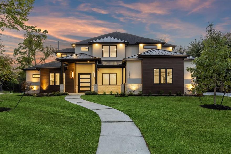 Experience modern luxury in this architectural masterpiece. Nestled in a serene neighborhood, this newly constructed home exudes craftsmanship and contemporary elegance. Inside, natural wood floors create a seamless flow. Double-height ceilings amplify the airy ambiance, bathing spaces in natural light. The gourmet kitchen is a chef's dream with top-tier appliances and sleek design. A discreet pantry enhances functionality. Bedroom suites on the main level provide convenience and custom closets blend storage with style. Forward-thinking construction features foam insulation and soundproofing, ensuring year-round comfort. Floating iron stairs lead to upper-level bedrooms and versatile spaces.Extensive outdoor lighting enhances beauty and security, while the garage showcases epoxy floors. Rest easy with a 10-year foundation and structural warranty. This modern home epitomizes luxury living with its design, construction, and amenities. Seize this opportunity for sophisticated comfort.