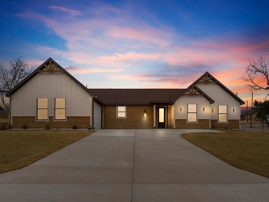Welcome to this beautifully crafted brand-new 4-bedroom, 2-bathroom home in Granbury, Texas, designed with comfort, style, and everyday living in mind. From the moment you step inside, you’re greeted by a bright, open layout that creates a seamless flow between the main living spaces—perfect for both quiet evenings at home and hosting friends and family.
The kitchen is featuring stunning white quartz countertops, a spacious pantry for ample storage, stainless steel appliances including an electric range, microwave, and dishwasher, and a large stainless steel sink that makes meal prep and cleanup a breeze. The open design allows the kitchen to overlook the living room, keeping everyone connected.
The expansive living room offers plenty of space to gather and unwind, highlighted by a sleek electric fireplace that adds warmth and ambiance to the space.
The private primary suite is thoughtfully positioned for comfort and relaxation. It features a generous walk-in closet and a spa-inspired ensuite bathroom complete with white granite countertops, a luxurious garden tub, and a separate shower—your own personal retreat at the end of the day.
Three additional bedrooms provide flexibility for family, guests, or a home office, all conveniently located near the second full bathroom, which continues the home’s cohesive finishes.
Step outside to enjoy a large yard area with a covered porch—ideal for morning coffee, weekend barbecues, or simply relaxing while taking in the Texas evenings. The home is fully encapsulated with spray foam insulation for enhanced energy efficiency and includes a built-in sprinkler system.
Located in the desirable Indian Harbor subdivision, this home offers the perfect blend of peaceful living and convenient access to everything Granbury has to offer. Buyer may select the color and style of the backsplash, and the finish color of the fireplace, to match their personal preference.
Don’t miss your opportunity to make this beautiful new home yours.