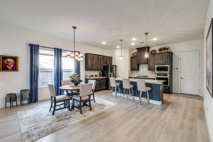 You’ll love this gorgeous Prairie Oaks home from the minute you walk in the front door!  The spacious and light open floor plan is perfect for entertaining.  The kitchen boasts 3cm quartz counters, gas cook top, updated pendant lighting, and stainless appliances.   The living room has a gas log fireplace framed with stone tile and accented with a darker painted mantle.  Enjoy the covered patio with a built-in grill and extended patio pavers that give you extra space for outdoor seating.  The seller has added a nice touch to the front yard by adding a patio sitting area in addition to a stone paved side yard for ease of maintenance. The spacious owner’s suite is split from the two guest bedrooms, and the primary bath has a soaking tub and separate shower.  For those who work from home, you’ll find a generous size office with French doors located in the front of the home.  Two additional guest bedrooms and bath complete this amazingly cared for, beautiful home.  As a bonus, you are just a short walk to the community pool, playground and picnic area.   Window treatments & custom window shades will remain with the home.