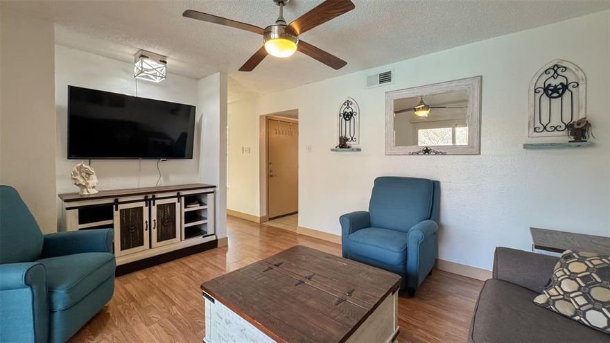 Welcome to 5335 Bent Tree Forest Drive #212C, a charming and well-maintained condo located in a gated community in the heart of North Dallas.
This inviting unit features a bright and open living space with warm wood-style flooring, a cozy fireplace, and abundant natural light from the sliding glass doors that lead to a private balcony overlooking the pool—perfect for relaxing or entertaining. The living area flows seamlessly into the dining space and kitchen, creating a comfortable and functional layout. The kitchen offers granite countertops, ample cabinet storage, and comes fully equipped with appliances, including the refrigerator, washer, and dryer, all of which convey with the property. The spacious bedroom provides a peaceful retreat with generous closet space, while the updated bathroom features granite counters and a clean, modern feel. Recent updates add peace of mind, including new windows (Feb 2023), a recently replaced AC unit (Oct 2024), and a roof replaced approximately 3 years ago. Enjoy the convenience of a prime location just minutes from the Galleria Mall, major highways, dining, and entertainment, making commuting and daily living effortless. Whether you’re a first-time buyer, downsizing, or looking for an investment opportunity, this move-in ready condo offers comfort, style, and an unbeatable location. TVs and Furniture negotiable.