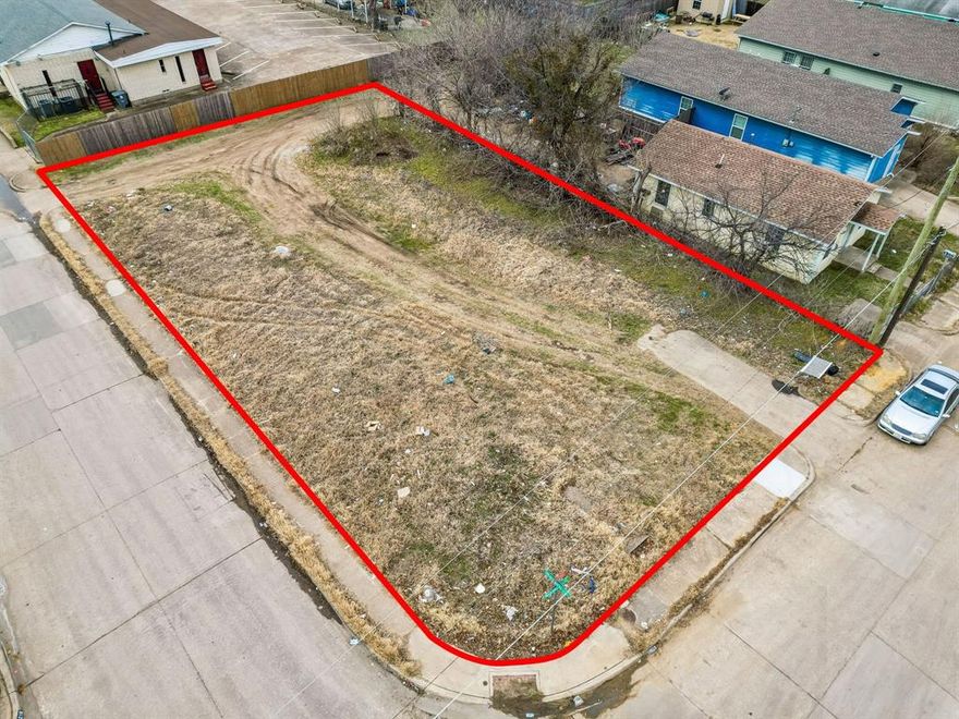 Large corner lot, perfect for new construction.