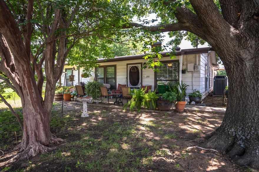 Charming Home with Commercial Zoning in Historic Downtown!       1 block from the ACE Hardware building currently under construction. 

Nestled on a generous .69-acre lot in the heart of historic downtown, this unique property offers incredible flexibility with commercial zoning—perfect for a live or work setup, office space, boutique business, or continued residential use. Surrounded by mature trees and lush greenery, it feels like a private retreat while still offering ample parking for clients, guests, or tenants.

The oversized detached garage provides exceptional storage or workshop space, and the recently upgraded HVAC system ensures year-round comfort in the living areas. Whether you're looking to establish a business in a high-visibility location or simply enjoy the character of downtown living, this property blends charm, convenience, and opportunity.

Don’t miss your chance to own a piece of history with endless potential!   zoned c 3 with an I 35 overlay