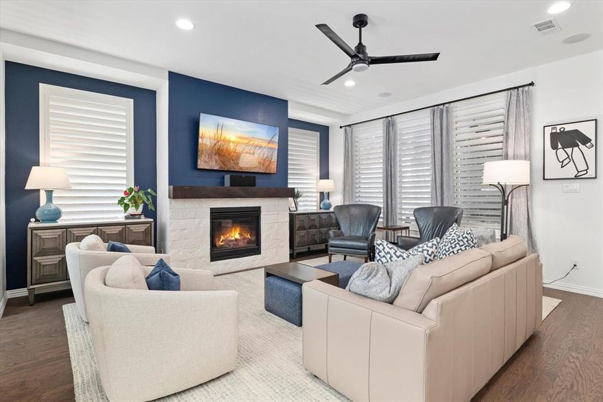 In a sea of builder-grade white, here’s your chance to move right into a home that still feels new—but with designer finishes and smart upgrades already in place.

From the inviting front porch to the airy, open living spaces, this home strikes the rare balance between polished and livable. Rich engineered hardwoods run throughout the main level, paired with modern, cohesive paint tones and upgraded lighting that instantly elevate the space. Just off the main living area, a built-in office nook is perfectly positioned for work-from-home days or homework drop-offs.

The kitchen is both beautiful and functional, featuring light quartz countertops, a built-in gas range with exterior-vented hood, under-cabinet lighting, and a walk-in pantry that actually lives up to the name. Nearby, a custom mudroom built-in keeps backpacks and daily clutter in check, while the laundry room adds cabinetry, shelving, and a utility sink for real-world convenience.
The primary suite is tucked away on the main level, offering generous space and a calm retreat feel. Upstairs, the layout continues to impress with a large gameroom and secondary bedrooms enhanced by upgraded flooring in place of builder carpet. Plantation shutters throughout the home add a finished, tailored look you simply don’t find at this stage of ownership.

Step outside and you’ll see where this home truly separates itself. The extended patio and covered pergola create a full outdoor living space, complete with built-in grill, refrigerator, storage, and room for a smoker—ready for game days, weekend dinners, and casual entertaining. Thoughtful privacy upgrades, fresh landscaping, and plenty of grassy yard space round out the backyard experience.

All of this is set within a highly desirable community offering multiple pools, parks, trails, and a clubhouse with fitness center—delivering both style and lifestyle in one move-in-ready package.