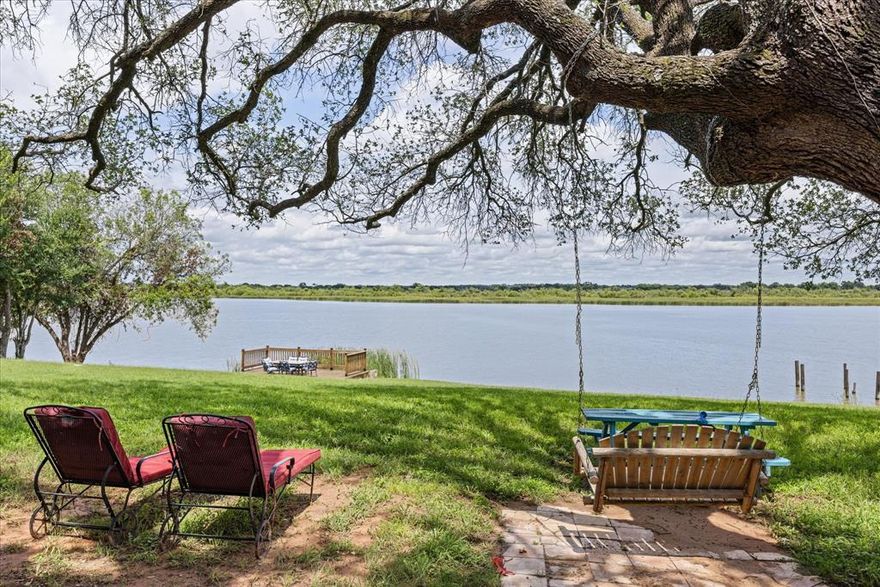 Escape to this rare waterfront retreat in charming Granbury, TX, perfectly positioned on a peaceful inlet of Lake Granbury with stunning water views and direct access for fishing, kayaking, or relaxing lakeside. This fully furnished and beautifully maintained Airbnb offers a serene getaway for families, couples, and small groups, all just minutes from the historic Granbury Square, wineries, shopping, and dining.
Set on multiple expansive lots, this property is more than just a vacation home. It’s a unique investment opportunity. With ample space to add additional tiny homes, casitas, or cabins, this site is ideal for growing your short-term rental portfolio or developing a lakefront wedding venue, glamping resort, or event space. The mature trees, scenic backdrop, and gentle slope to the water create a naturally inviting setting for celebrations or retreats. Inside the home, you'll find warm, rustic charm with modern updates: open-concept living and dining, a well-equipped kitchen, cozy bedrooms, and large windows overlooking the water. Guests rave about the peaceful sunrises from the private deck and nights around the firepit under Texas stars.
Whether you’re looking for a weekend escape, a high-performing Airbnb, or a long-term development project, this property offers versatility, income potential, and endless waterfront appeal. Opportunities like this don’t come often. Unlock the full potential of lakefront living in Granbury today.