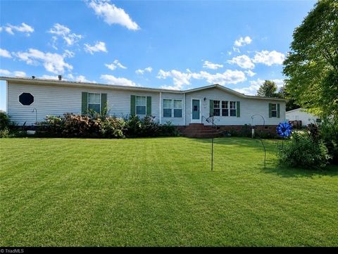 Photo of 6350 Sheringham Drive, Tobaccoville, NC 27050 (MLS # 1220129)