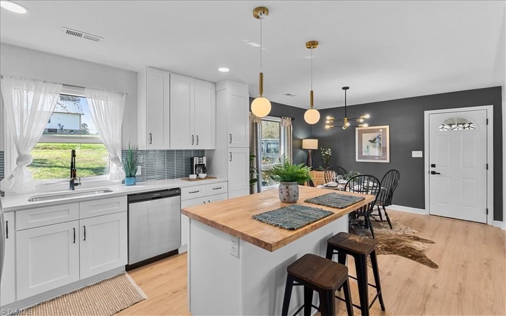 Photo of 219 Tarheel Drive, Archdale, NC 27263 (MLS # 1212157)