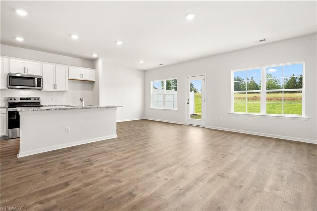 Photo of 7058 Eclipse Trail, Whitsett, NC 27377 (MLS # 1210838)