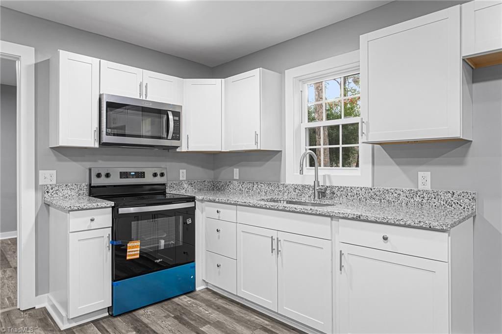 Photo of 424 Rocky Knoll Road, Greensboro, NC 27406 (MLS # 1203457)