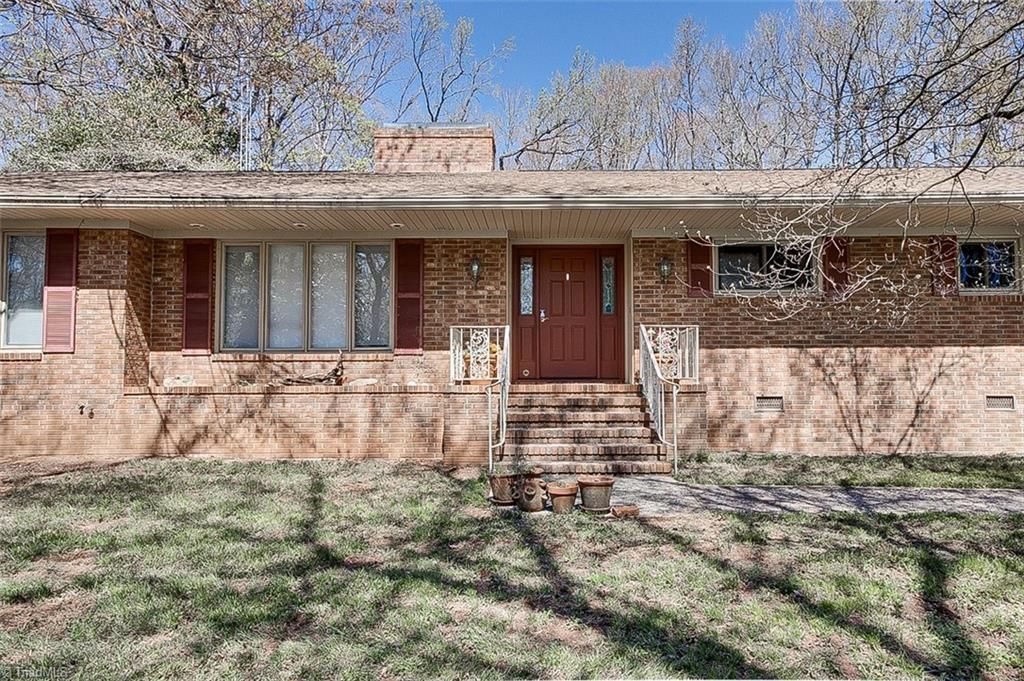 Photo of 215 Pineburr Road, Greensboro, NC 27455 (MLS # 1212858)