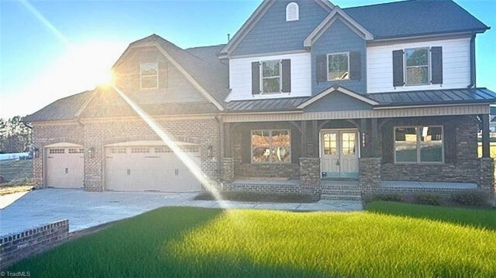 Photo of 7731 Maple Pond Drive, Oak Ridge, NC 27310 (MLS # 1203444)